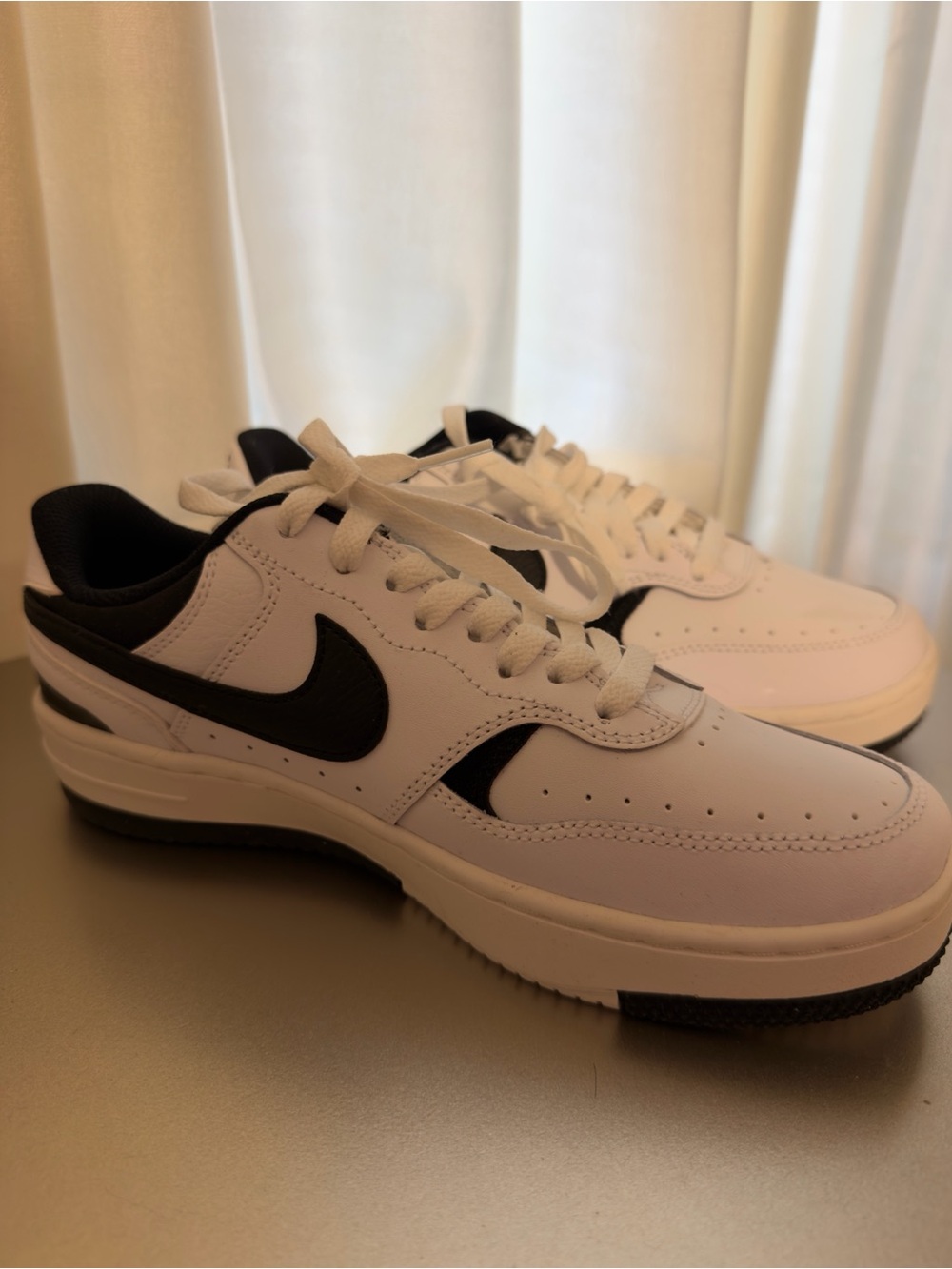 Nike White and Black Low-Top Sneakers with Black Swoosh